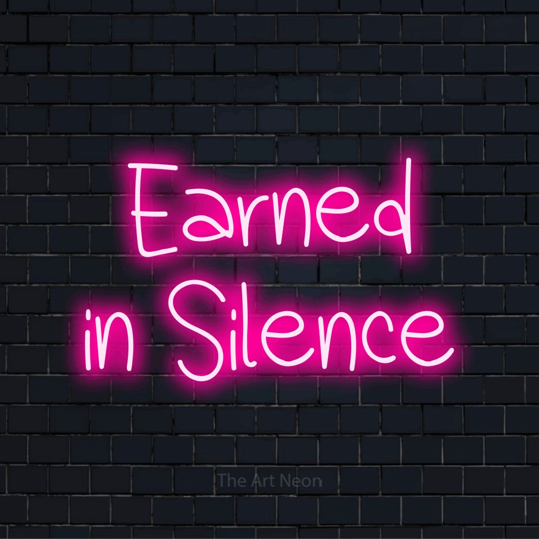 "Earned In Silence" text design with neon effect on a black brick wall