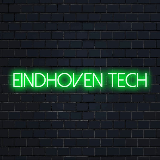 Eindhoven Tech LED Neon Sign, glowing lettering against black brick wall