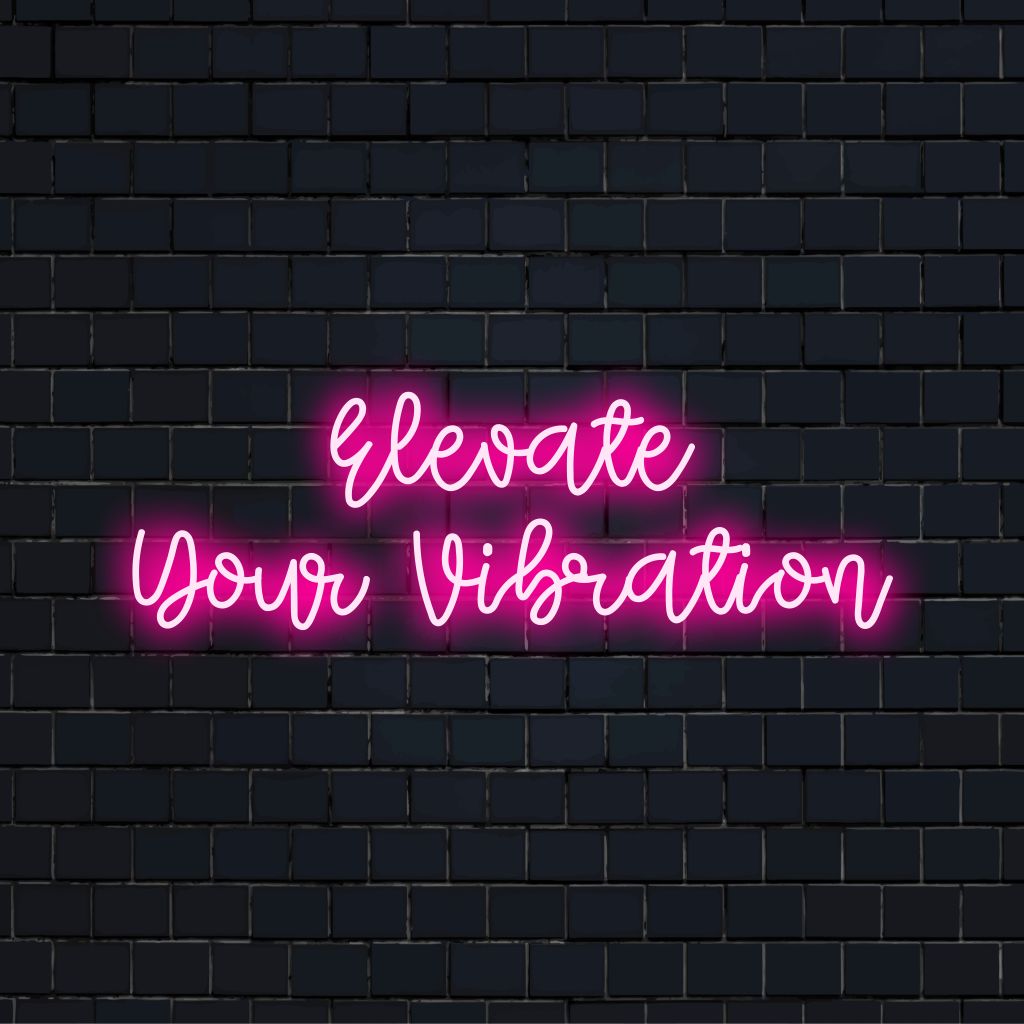 Elevate Your Vibration LED Neon Sign, soft neon glow against black brick wall