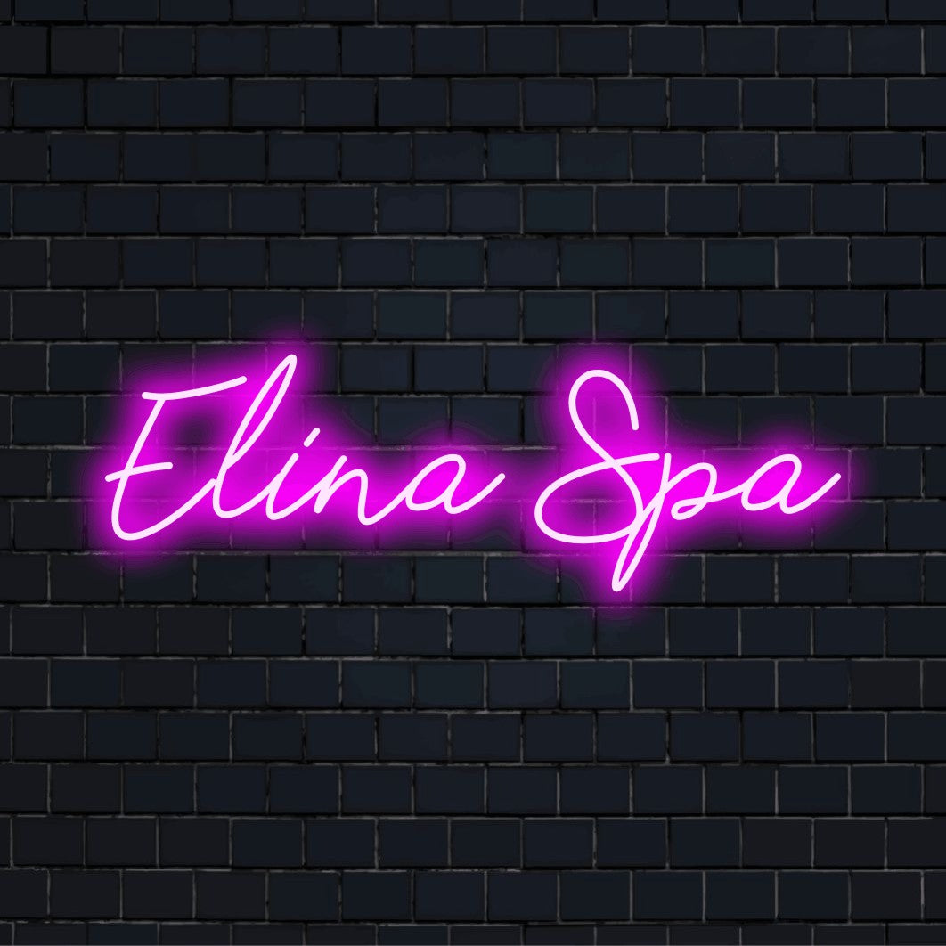 Elina Spa Custom Name Neon Sign, glowing lettering against black brick wall
