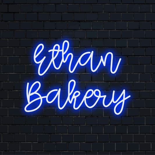 Ethan Bakery Custom Name Neon Sign, neon text light on dark brick background
