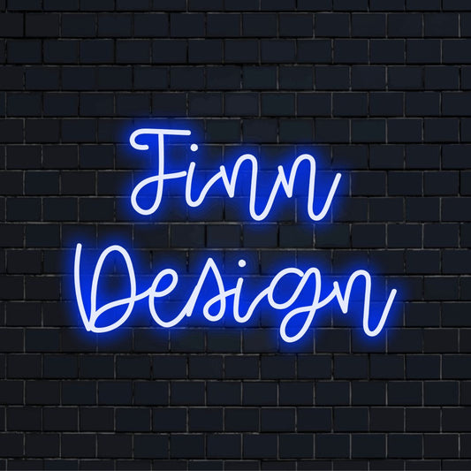 Finn Design Personalized Neon Light with bright neon lettering against brick backdrop