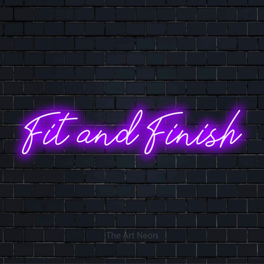 "Fit And Finish" text design with neon effect on a black brick wall