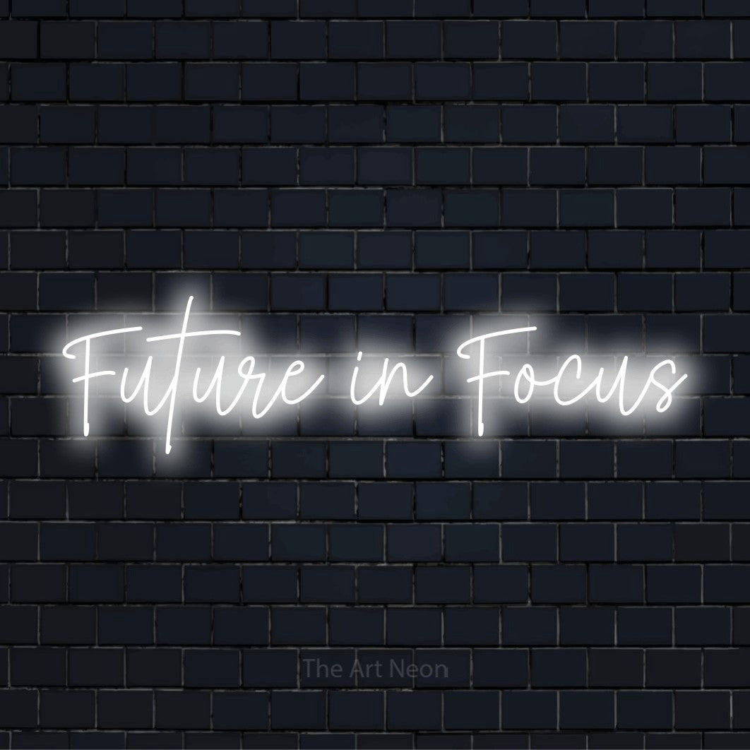"Future In Focus" LED neon sign on a black brick wall