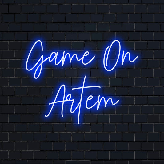 Game On Artem Custom Name Neon Sign, bright LED glow against black brick wall