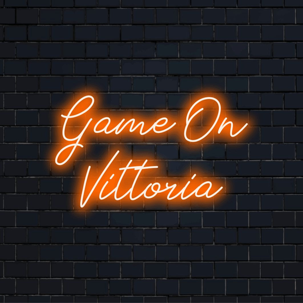 Game On Vittoria Custom Name Neon Sign, neon text light on dark brick wall