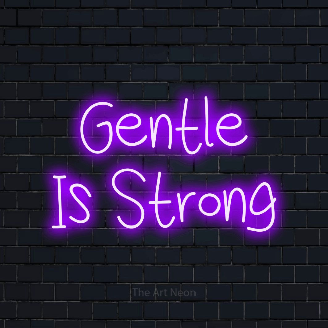 "Gentle Is Strong" text design with neon effect on a black brick wall