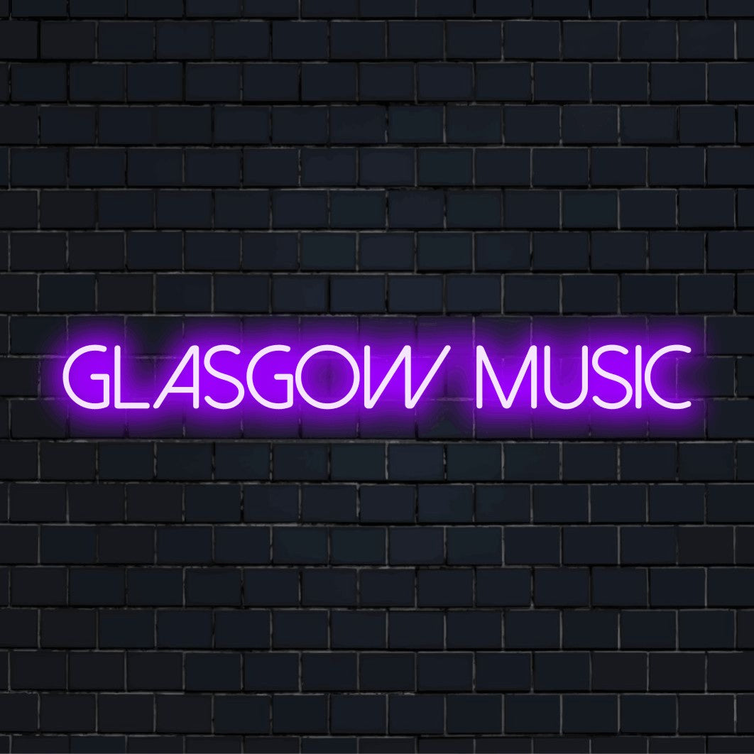 Glasgow Music Neon Sign, glowing neon text on dark brick wall