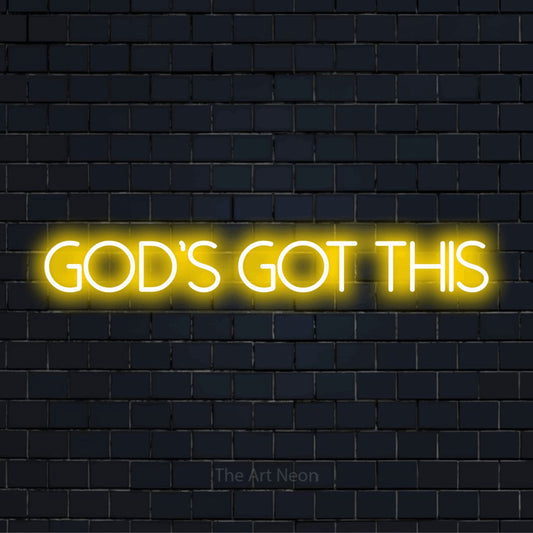 "God’s Got This" script-style LED neon sign on a black brick wall