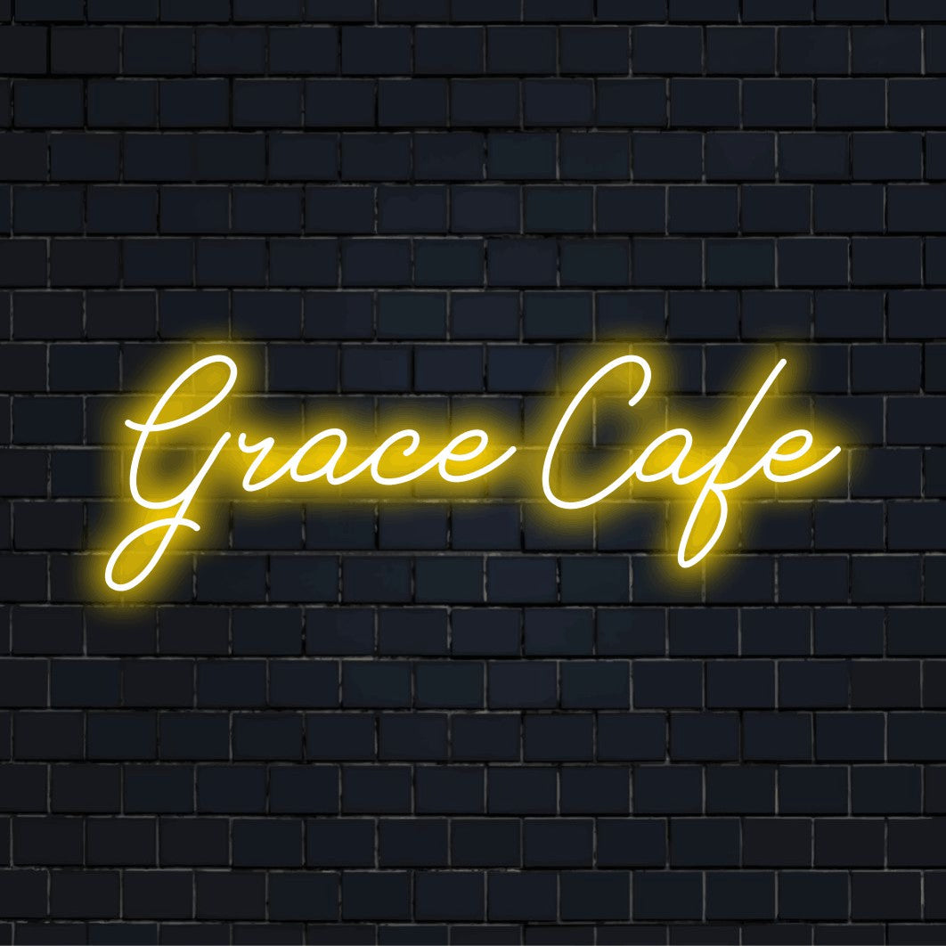 Grace Cafe Custom Name Neon Sign, glowing wall decor against black brick wall