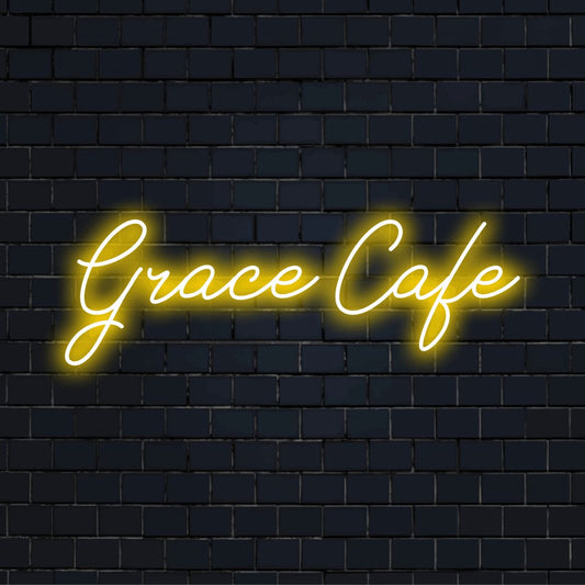 Grace Cafe Custom Name Neon Sign, glowing wall decor against black brick wall