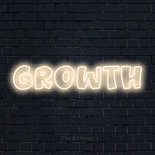 "Growth" text design with neon effect on a black brick wall