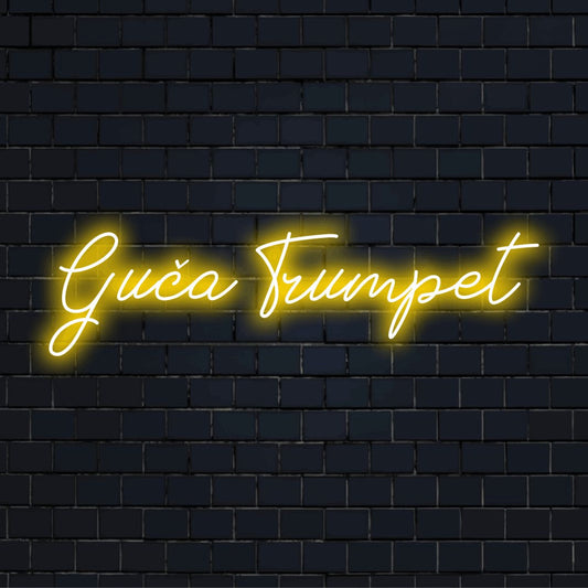 Gu A Trumpet Neon Sign, bright neon glow against black brick wall