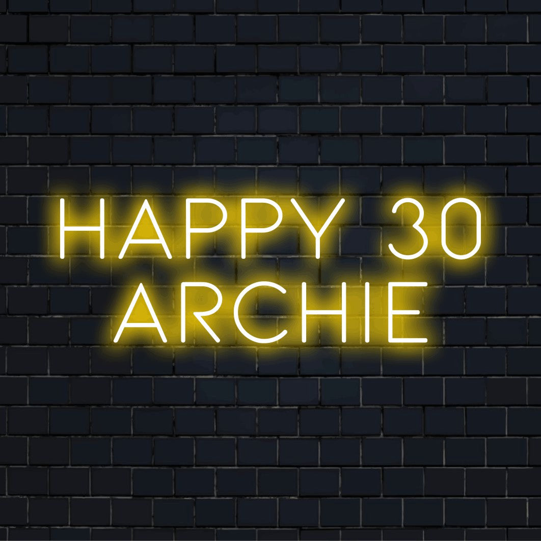 Happy 30 Archie Custom Name Neon Sign, bright LED glow on dark brick background