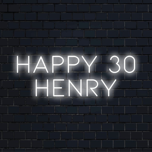 Happy 30 Henry Custom Name Neon Sign, bright neon lettering on dark brick wall