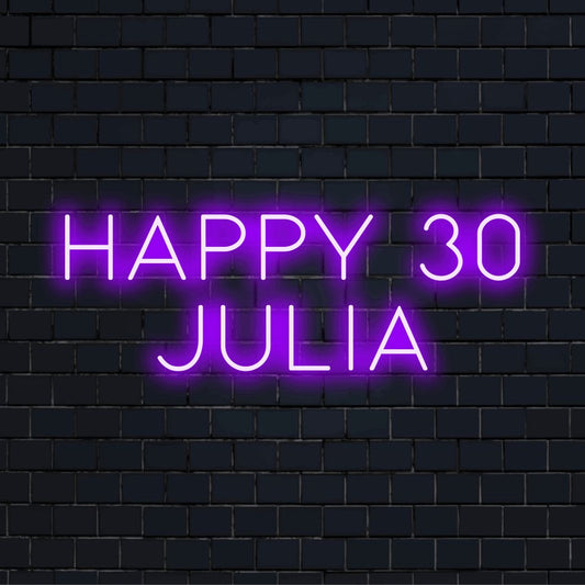 Happy 30 Julia Custom Name Neon Sign, glowing neon text against black brick wall
