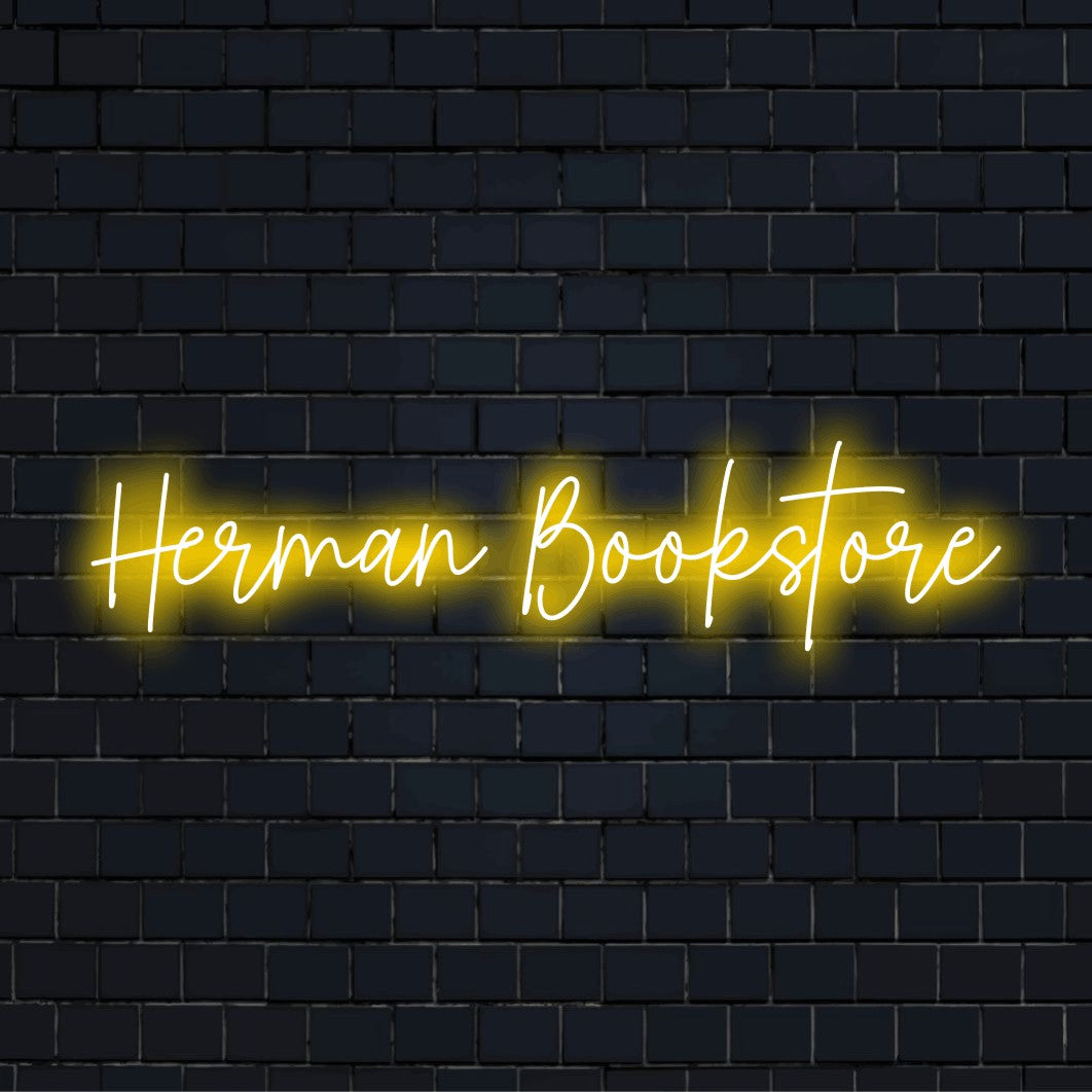 Herman Bookstore Personalized Neon Light with glowing lettering on dark brick background