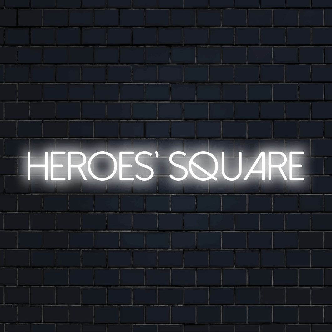 Heroes Square Neon Sign, neon text light on dark brick wall