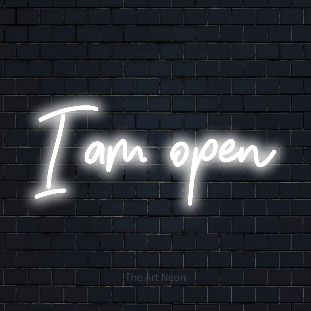 "I Am Open" LED neon sign on a black brick wall