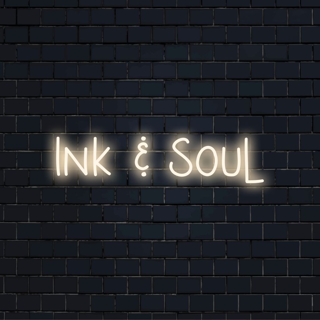 Ink Soul Neon Sign, bright neon glow against black brick wall