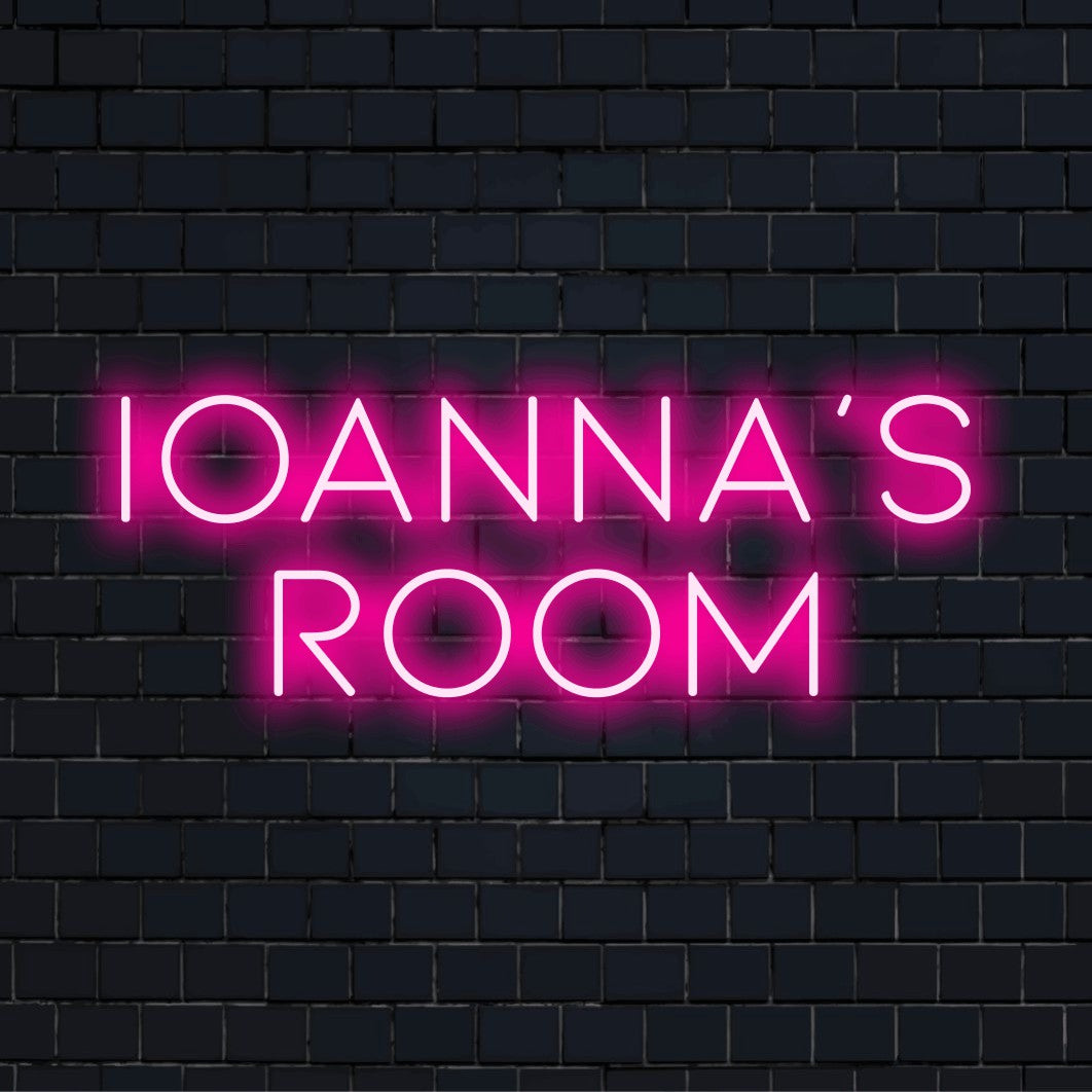 Ioanna_s Room Custom Name Neon Sign, glowing neon text against black brick wall
