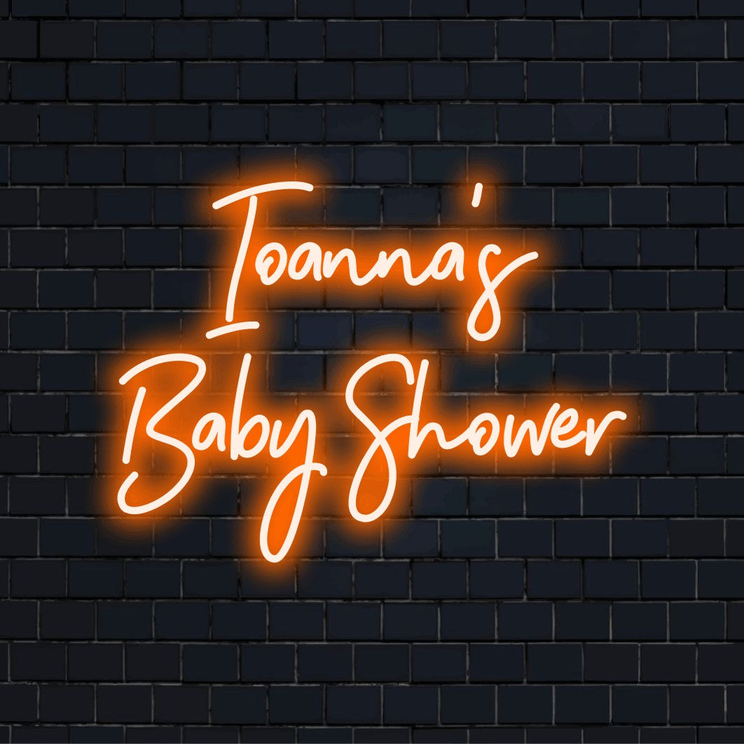 Ioanna_s Baby Shower Personalized Neon Light with glowing neon text on black brick background