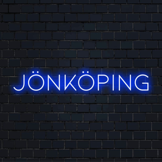 Jonkoping LED Neon Sign, glowing lettering against black brick wall