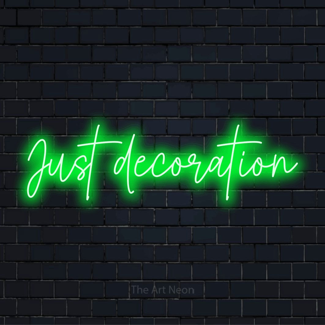 "Just Decoration" LED neon sign on a black brick wall