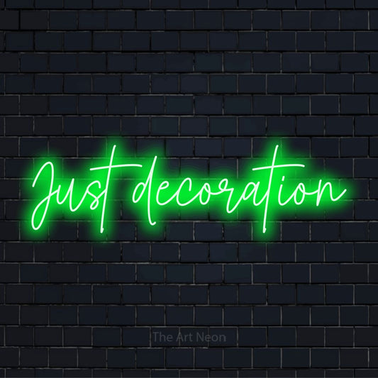 "Just Decoration" LED neon sign on a black brick wall