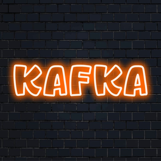 Kafka Neon Light with bright neon glow against brick backdrop