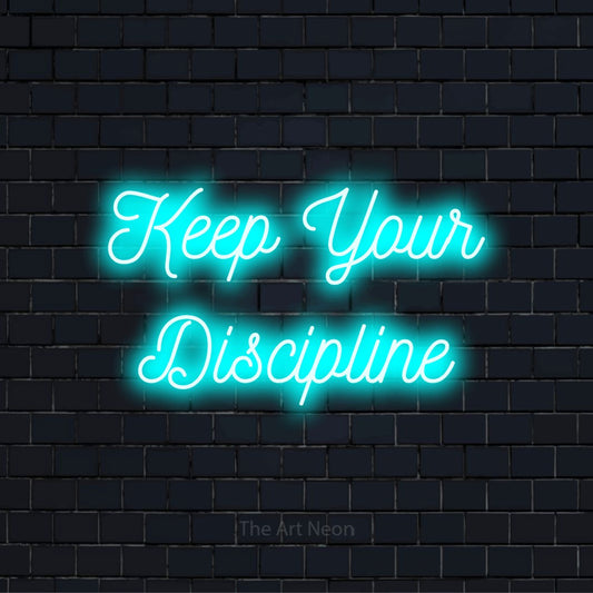 "Keep Your Discipline" script-style LED neon sign on a black brick wall
