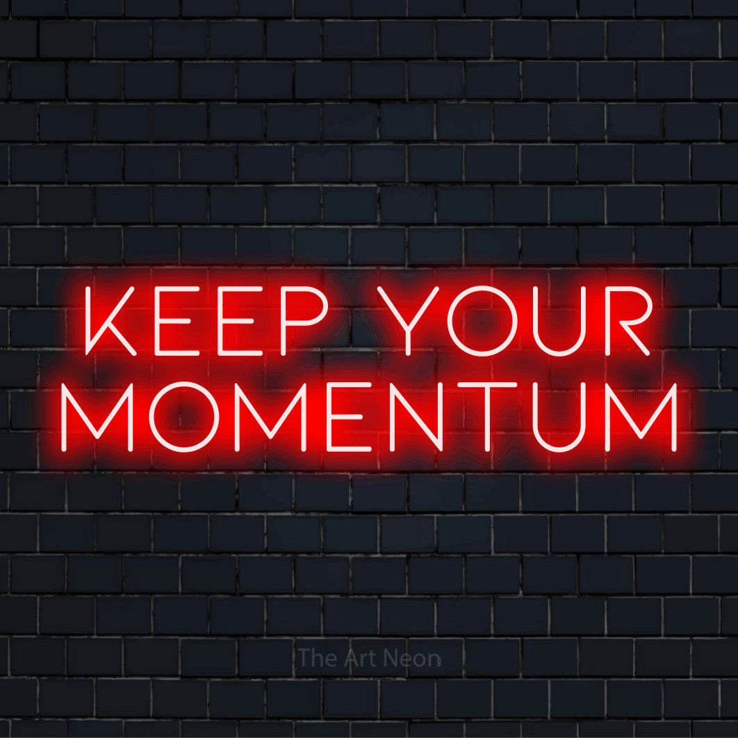 "Keep Your Momentum" neon text design on a black brick wall