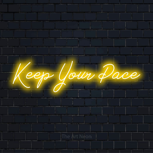 "Keep Your Pace" LED neon sign on a black brick wall