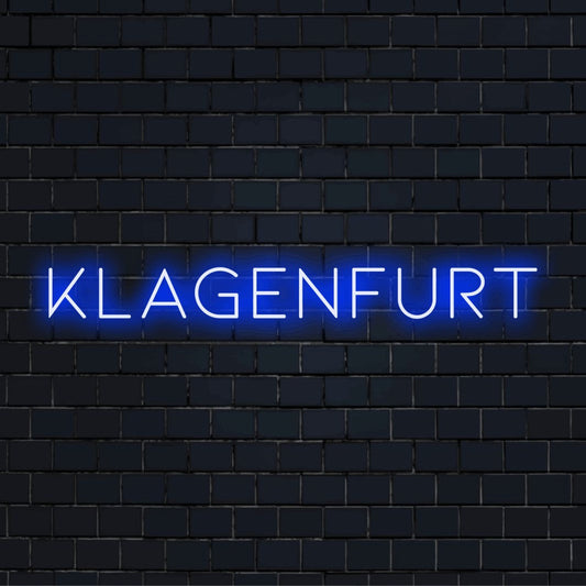 Klagenfurt Neon Light with soft neon glow on black brick background