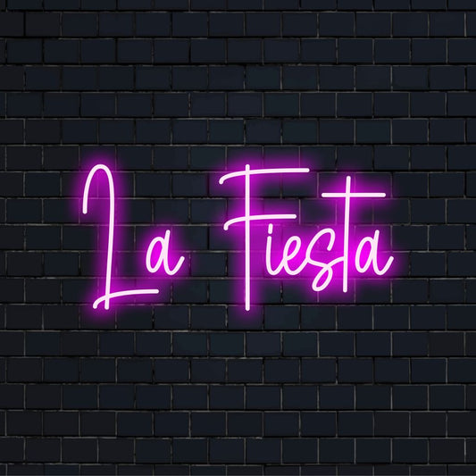 La Fiesta Neon Light with bright neon glow against black brick wall