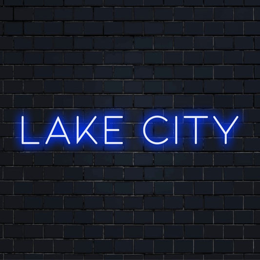 Lake City Neon Sign, bright neon glow on dark brick background