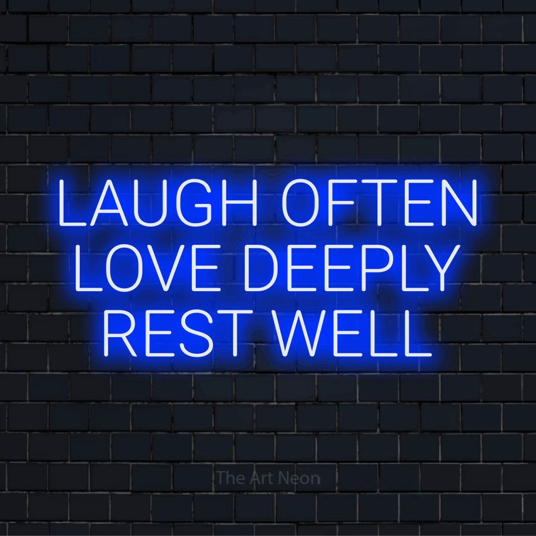 "Laugh Often Love Deeply Rest Well" glowing LED neon sign on a black brick wall
