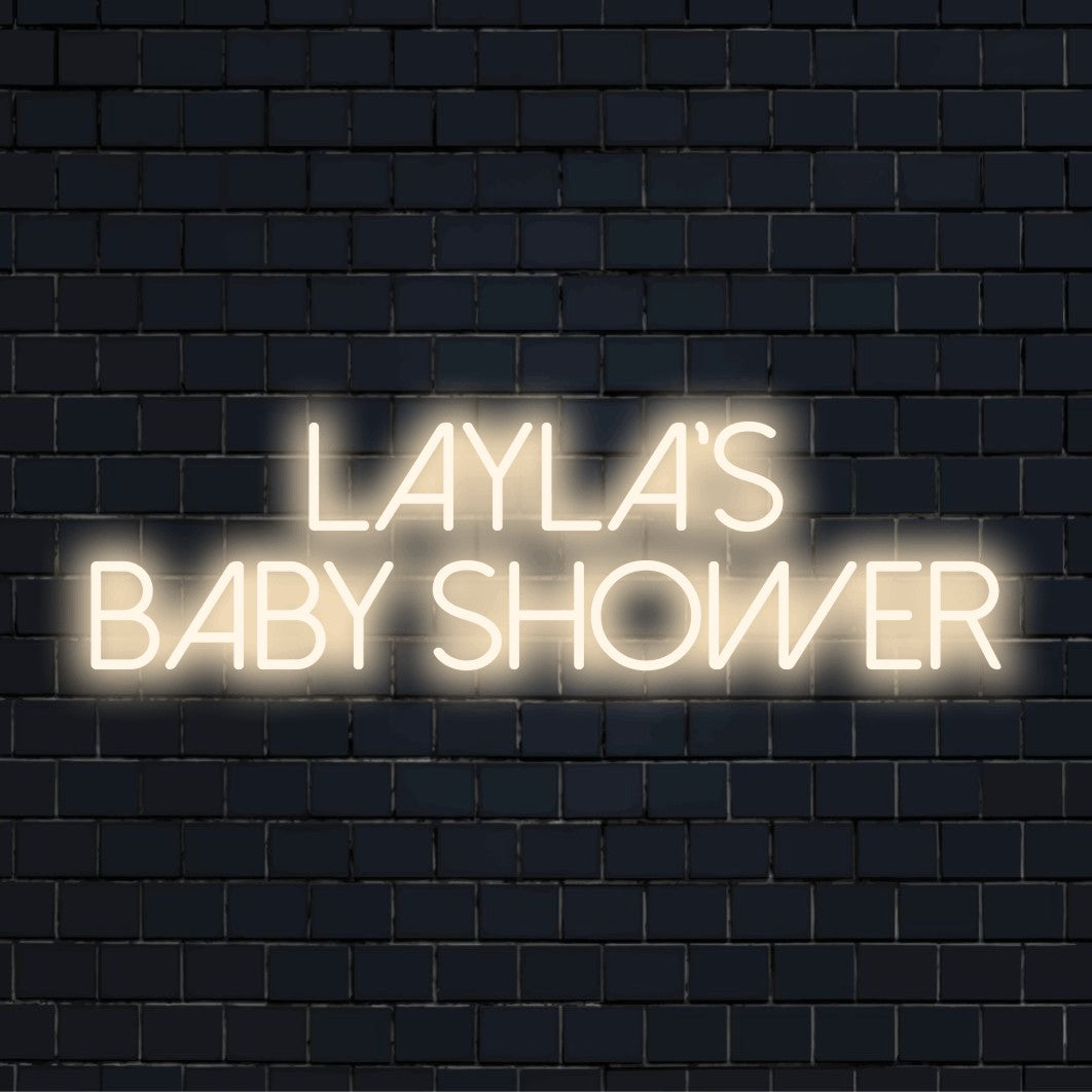 Layla_s Baby Shower Custom Name Neon Sign, bright LED glow against brick backdrop