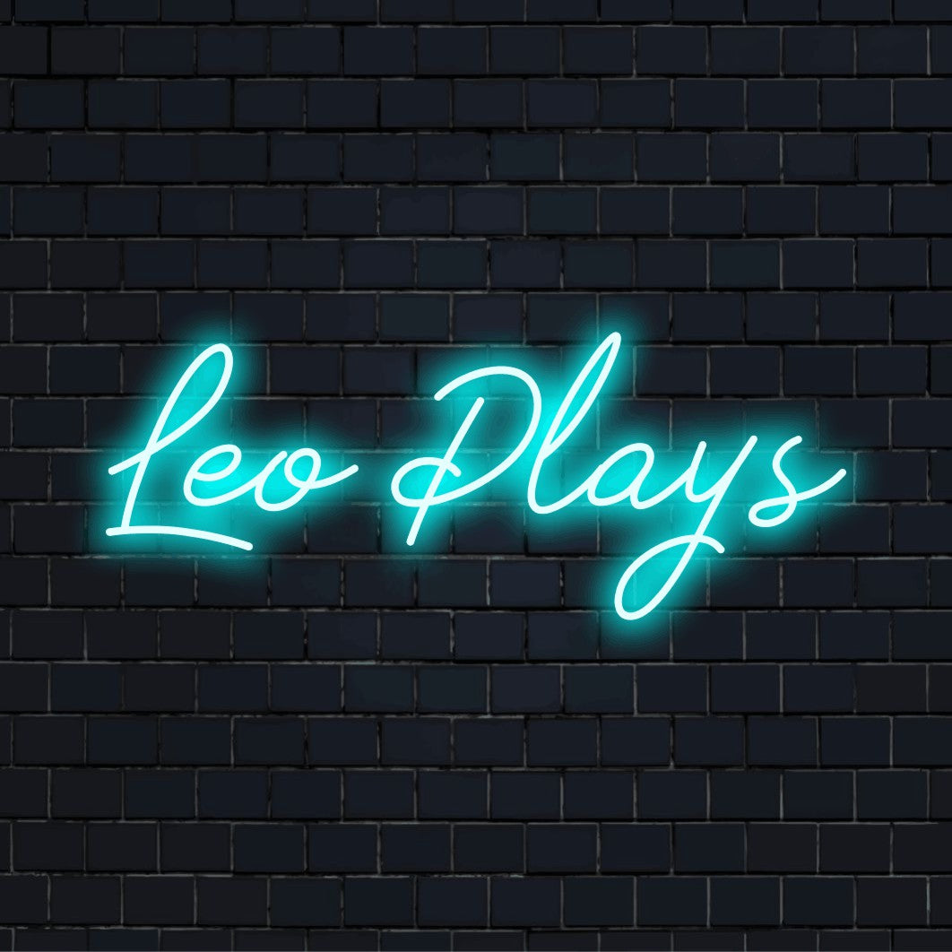 Leo Plays Custom Name Neon Sign, soft neon glow against brick backdrop