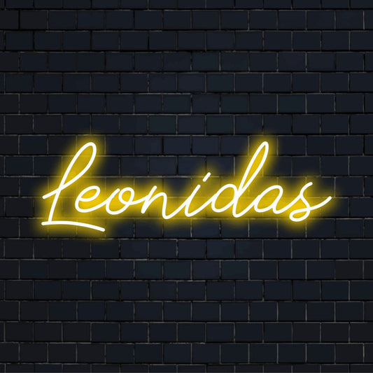Leonidas Neon Light with bright neon lettering on black brick background