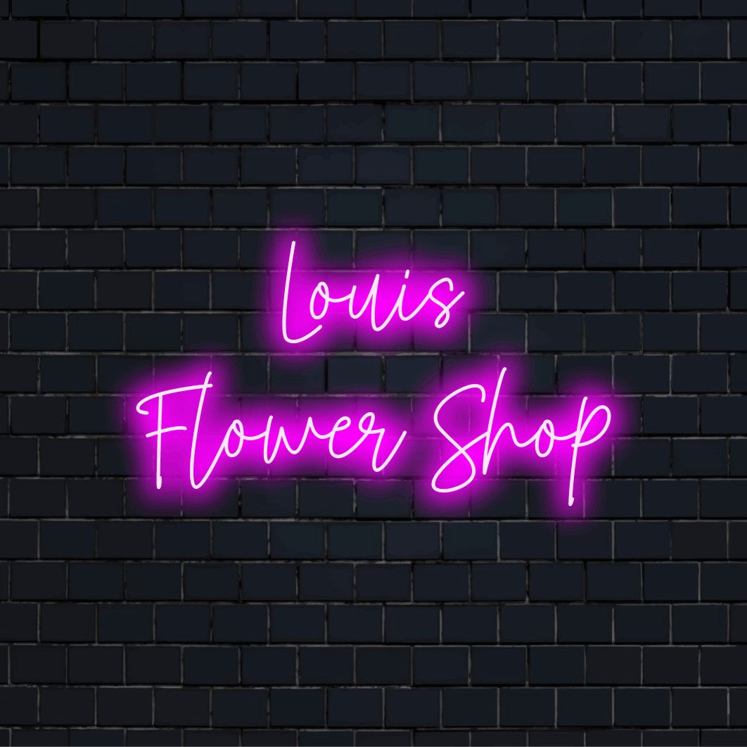 Louis Flower Shop Custom Name Neon Sign, glowing wall decor against brick backdrop