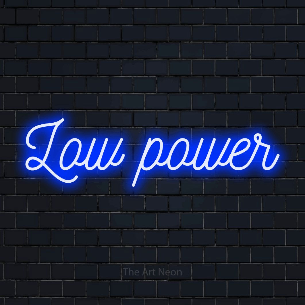 "Low Power" text design with neon effect on a black brick wall