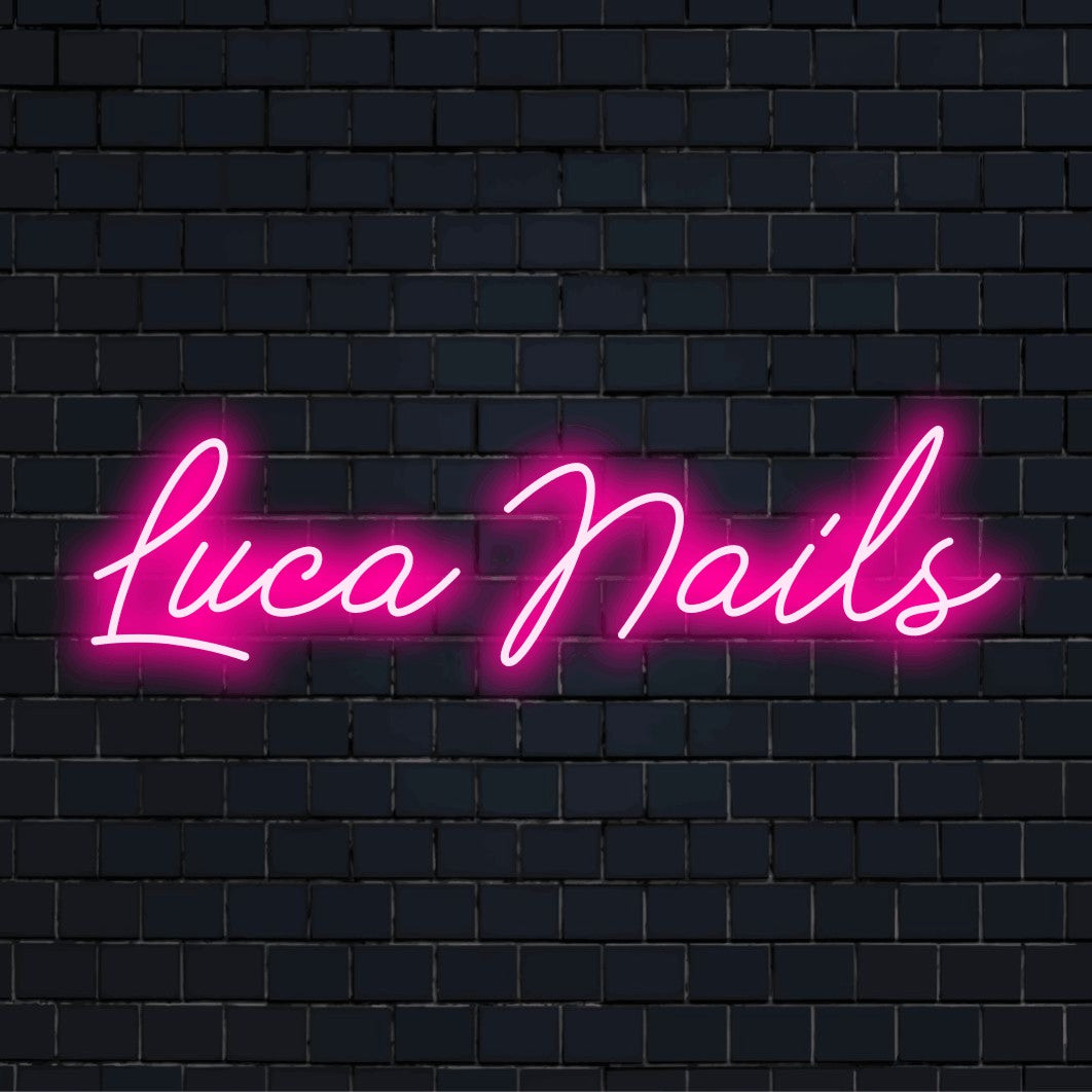 Luca Nails Custom Name Neon Sign, bright neon lettering against brick backdrop