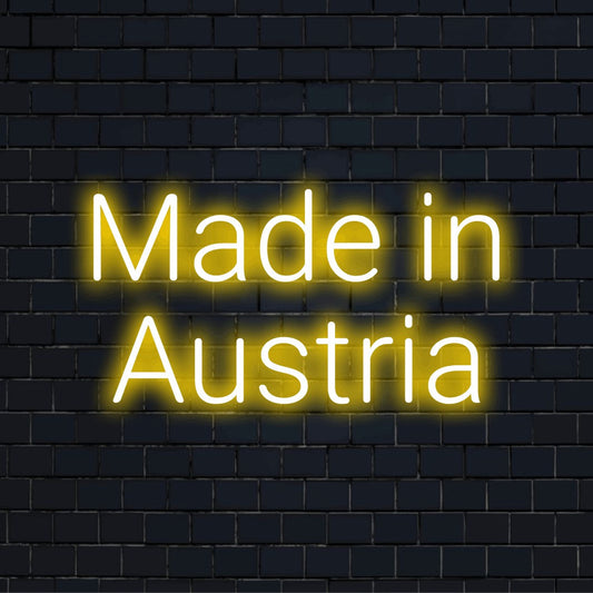 Made In Austria Neon Sign, bright LED glow on black brick background
