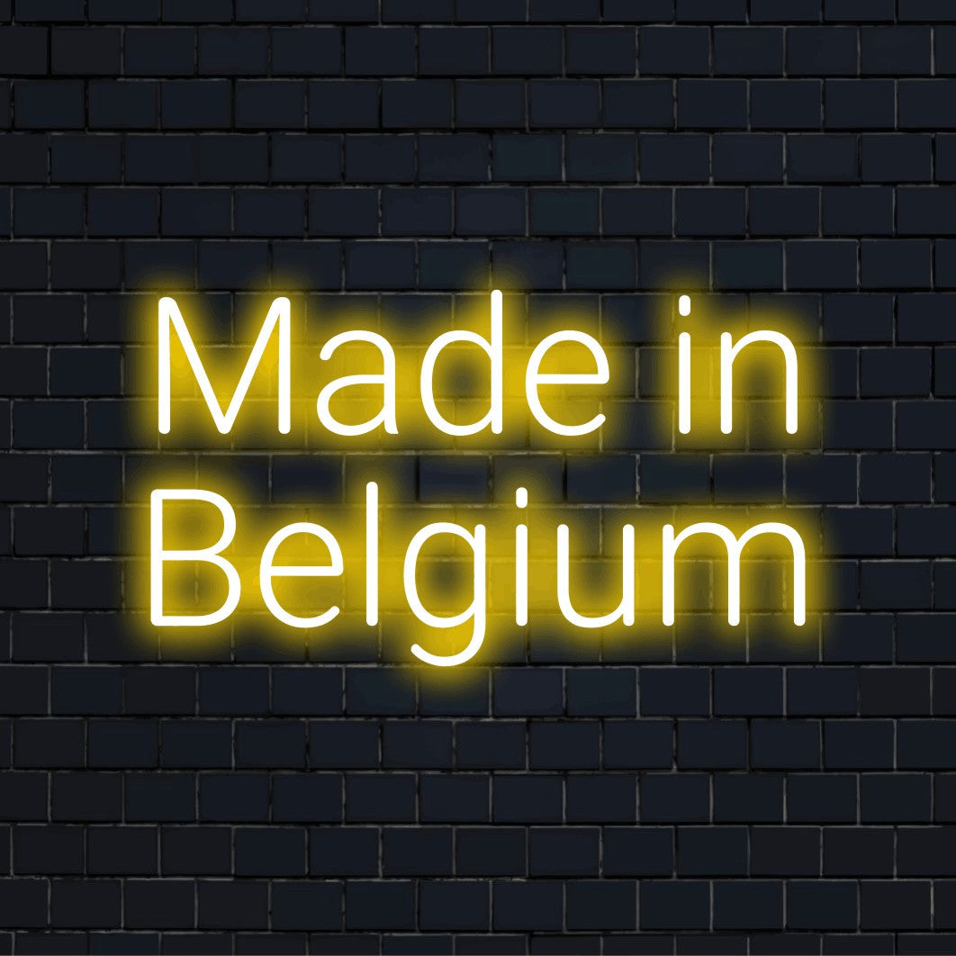 Made In Belgium Neon Light with bright neon glow against brick backdrop