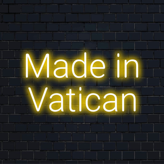 Made In Vatican Neon Light with neon text light against black brick wall