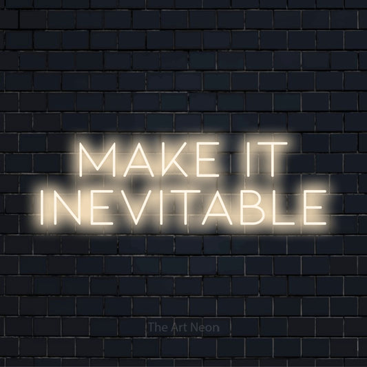 "Make It Inevitable" glowing LED neon sign on a black brick wall