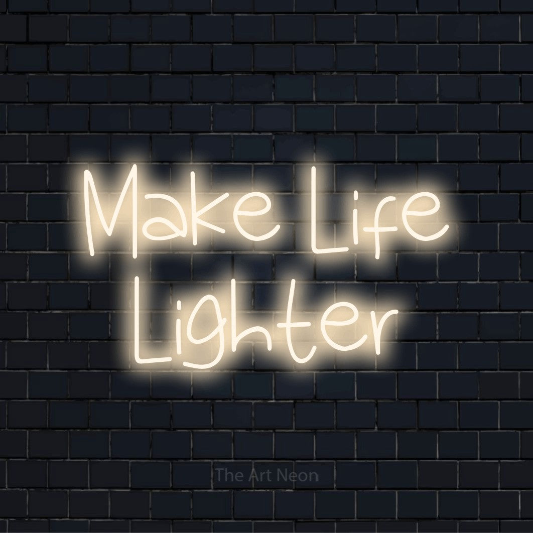 "Make Life Lighter" LED neon sign on a black brick wall