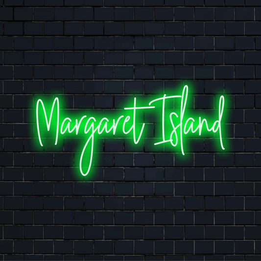 Margaret Island Neon Light with bright neon lettering against brick backdrop