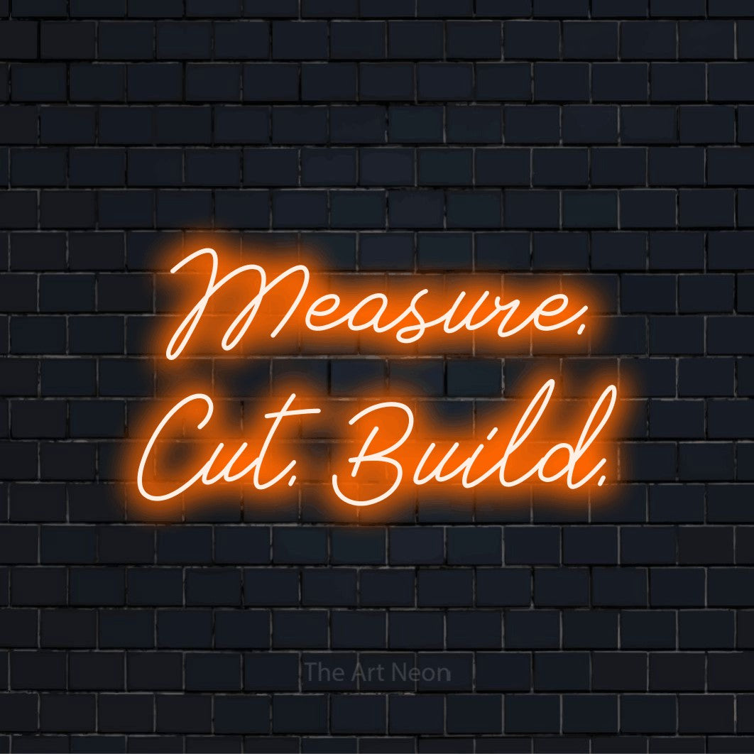 "Measure. Cut. Build." neon text design on a black brick wall